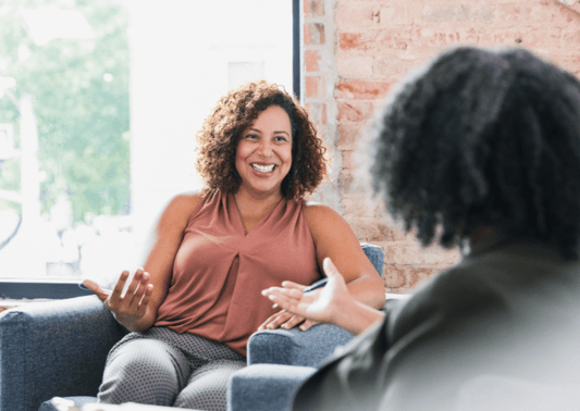 Smiling woman in therapy session, wellness and mental health support at MyMental LTD
